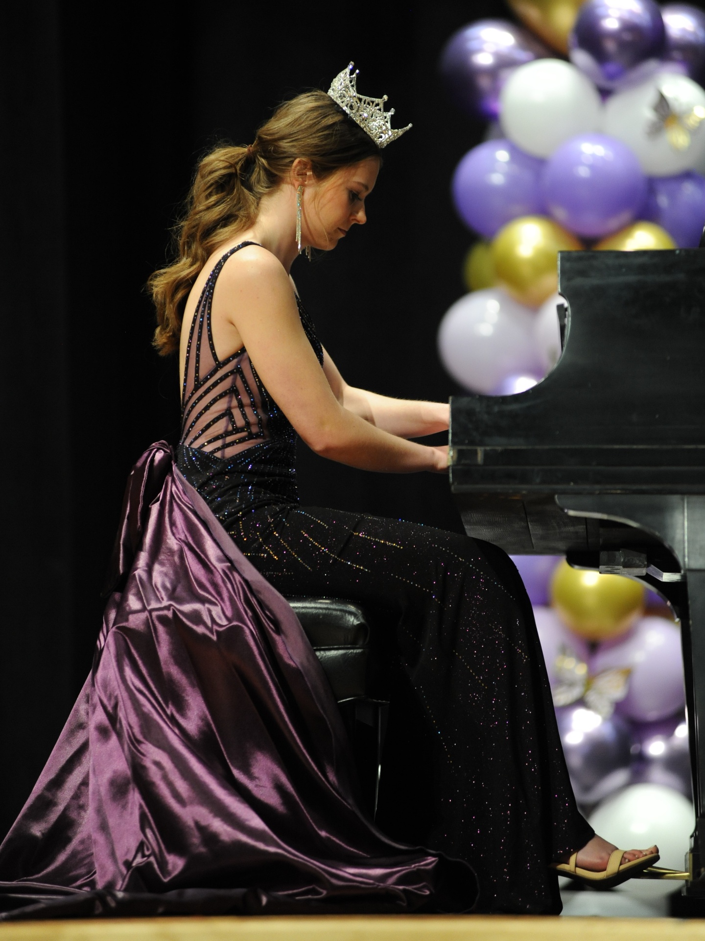 Pianist performing in formal gown
