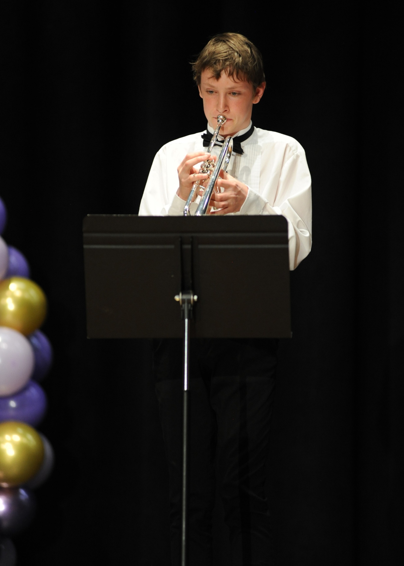 Student musician playing trumpet